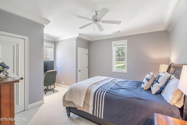 bedroom featuring ornamental molding, light carpet, and ceiling fan