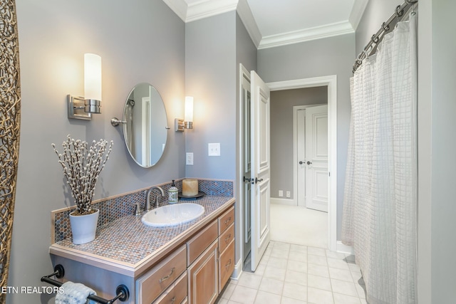 bathroom with vanity, crown molding, and tile patterned floors