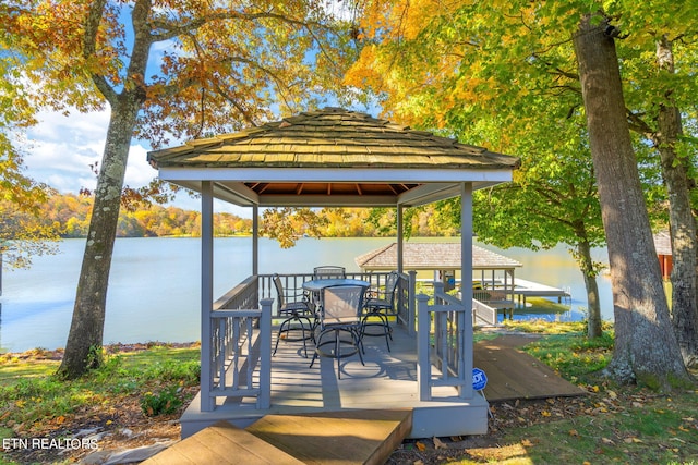 dock area with a gazebo and a water view