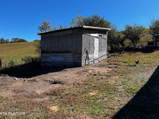 view of outdoor structure featuring a rural view