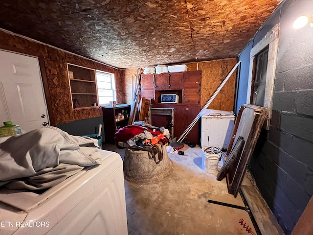 misc room with washer / dryer and concrete floors