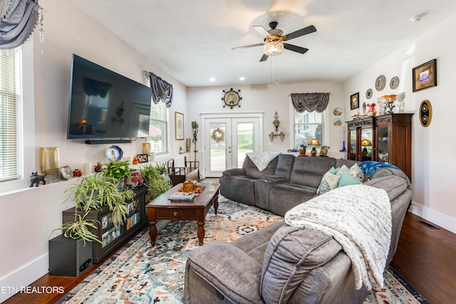 living room with hardwood / wood-style floors, french doors, and ceiling fan