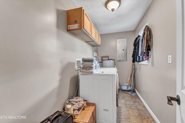 clothes washing area with washing machine and dryer, a textured ceiling, water heater, cabinets, and electric panel