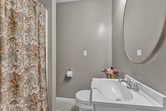 bathroom with vanity, a shower with curtain, toilet, and tile patterned floors