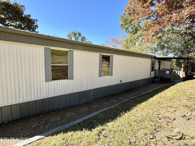 view of home's exterior with a lawn