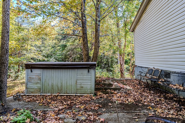 exterior space featuring a storage shed