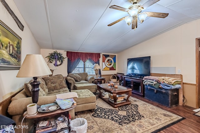 living room featuring ceiling fan, vaulted ceiling, and hardwood / wood-style floors