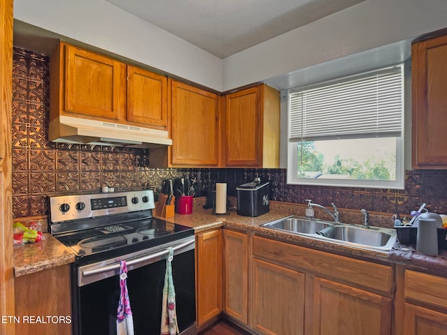 kitchen with tasteful backsplash, sink, and stainless steel range with electric cooktop