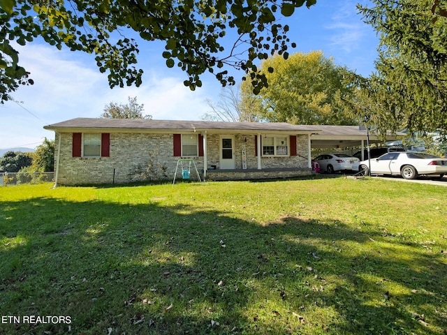 single story home with a front lawn and a carport