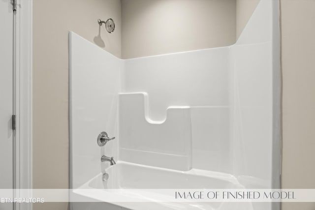 bathroom with shower / bathing tub combination