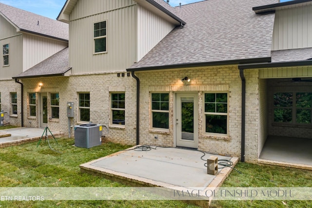 back of house with a patio area, cooling unit, and a yard