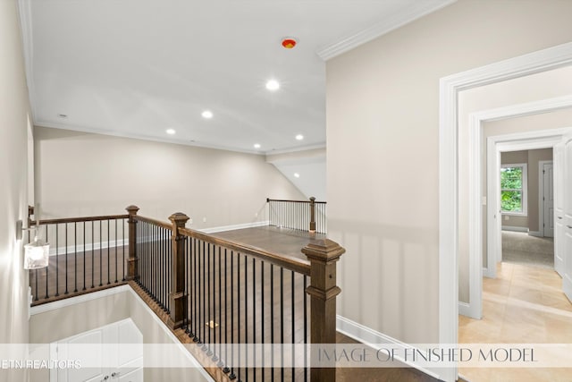 staircase with ornamental molding and tile patterned flooring