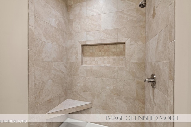 bathroom with tiled shower