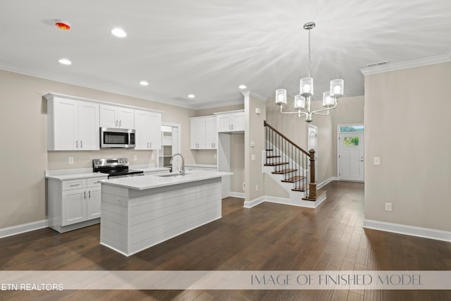 kitchen featuring appliances with stainless steel finishes, white cabinetry, dark wood-type flooring, and an island with sink