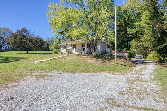 view of front facade featuring a front yard and a porch