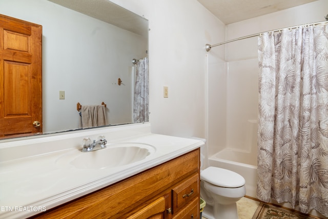 full bathroom featuring a textured ceiling, shower / bath combo with shower curtain, toilet, vanity, and tile patterned floors