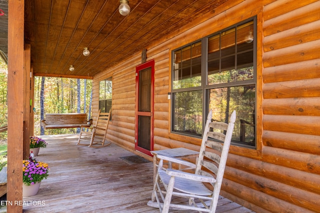 wooden deck featuring covered porch