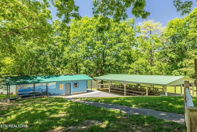 view of home's community with a yard and a carport