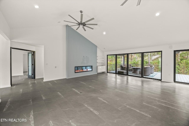 unfurnished living room featuring high vaulted ceiling and ceiling fan