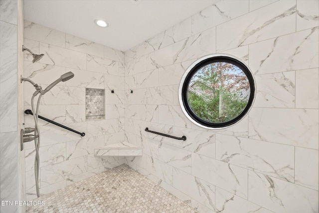 bathroom with tiled shower