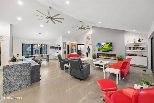 living room featuring high vaulted ceiling and ceiling fan with notable chandelier