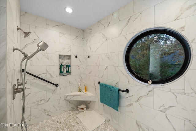 bathroom with tiled shower