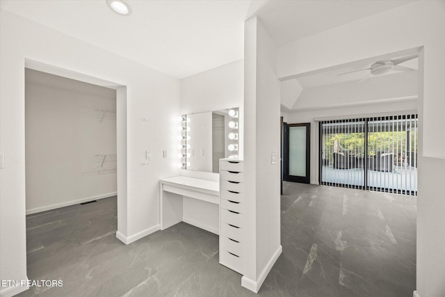 bathroom with ceiling fan and vanity