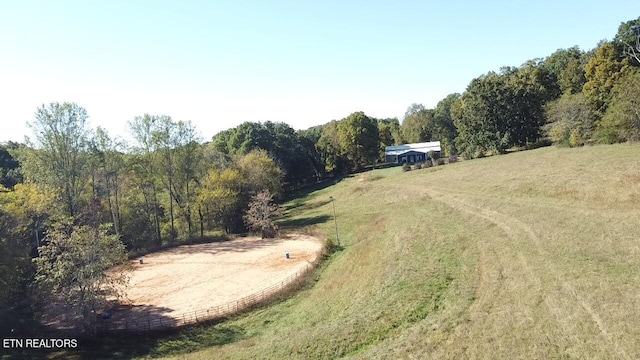 birds eye view of property with a rural view