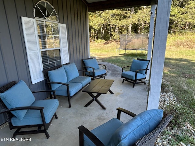 view of patio / terrace with an outdoor living space and a trampoline