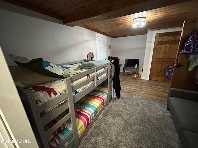 bedroom with wood ceiling and hardwood / wood-style floors