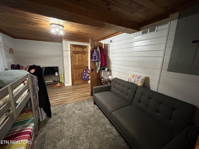 interior space with wood ceiling, wood walls, electric panel, and wood-type flooring