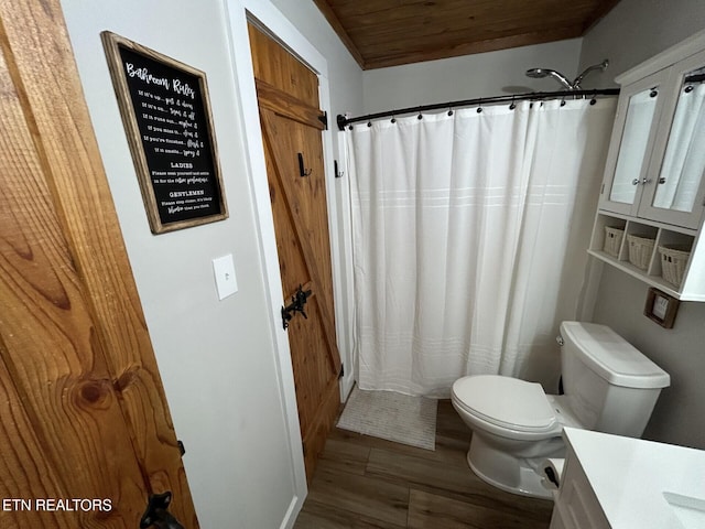 bathroom featuring toilet, wood-type flooring, wooden ceiling, a shower with shower curtain, and vanity