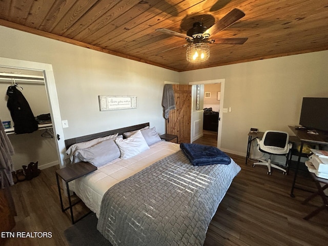 bedroom with wood ceiling, a closet, dark wood-type flooring, crown molding, and ceiling fan