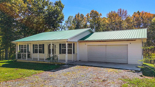 single story home with a front lawn and a garage