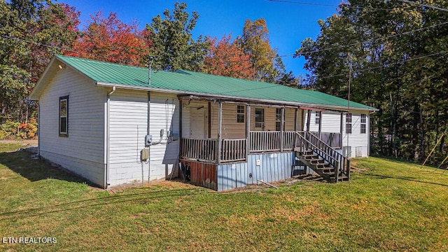 2732 Cherry Fork Rd, Helenwood, TN 37755 - view of front of property with stairway, metal roof, a porch, and a front lawn