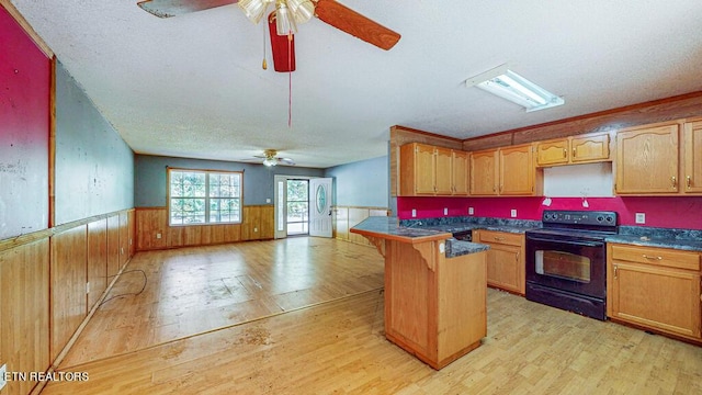 2732 Cherry Fork Rd, Helenwood, TN 37755 - kitchen featuring black electric range oven, dark countertops, a wainscoted wall, light wood finished floors, and a ceiling fan