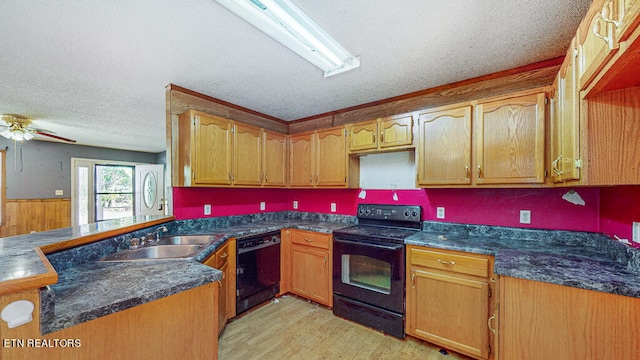 kitchen featuring black appliances, sink, a textured ceiling, kitchen peninsula, and light hardwood / wood-style flooring