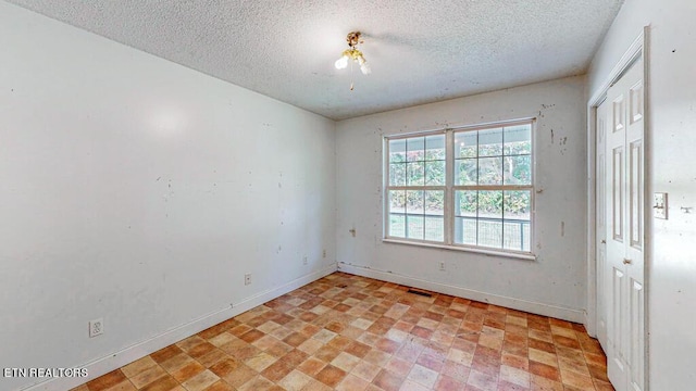 2732 Cherry Fork Rd, Helenwood, TN 37755 - empty room featuring a textured ceiling, visible vents, and baseboards