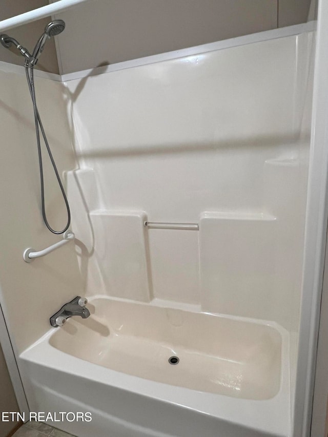 bathroom with shower / bathing tub combination