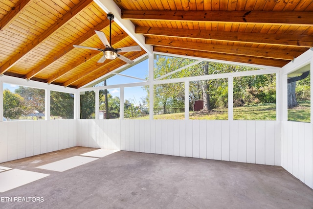 unfurnished sunroom featuring lofted ceiling with beams, ceiling fan, and wooden ceiling