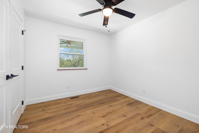 empty room featuring light hardwood / wood-style flooring and ceiling fan