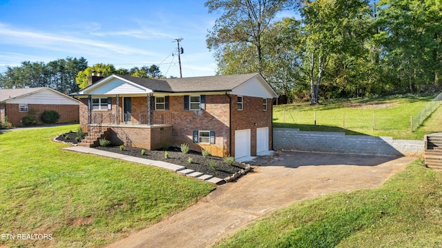 view of front of house with a front yard, a porch, and a garage