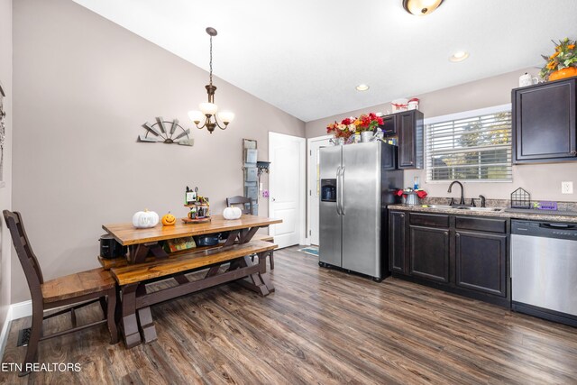 2670 Sharps Chapel Rd, Sharps Chapel, TN 37866 - kitchen featuring appliances with stainless steel finishes, a sink, a chandelier, dark wood finished floors, and vaulted ceiling