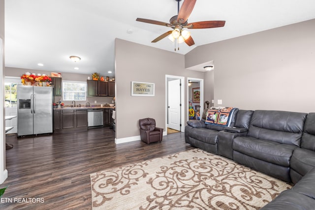 living room with sink, ceiling fan, vaulted ceiling, and dark hardwood / wood-style floors