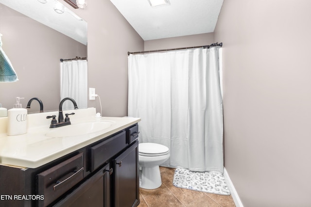 bathroom with toilet, vanity, tile patterned floors, and a shower with shower curtain