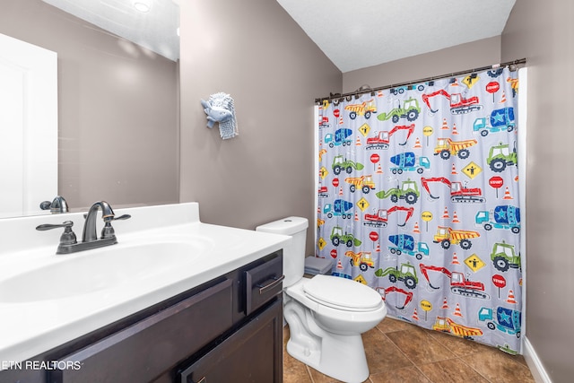 bathroom featuring vanity, toilet, curtained shower, and tile patterned flooring