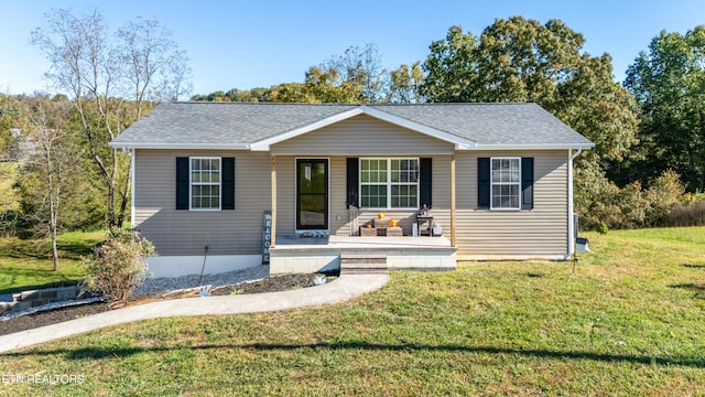 2670 Sharps Chapel Rd, Sharps Chapel, TN 37866 - view of front of house featuring a shingled roof, a front yard, and a porch