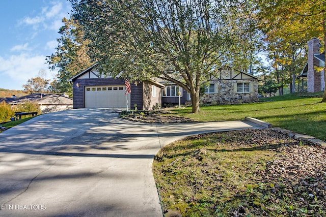 view of front of house featuring a front yard and a garage