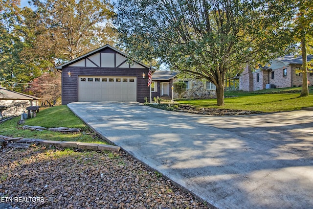 view of front facade featuring a front lawn and a garage