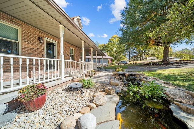 1440 Hicks Rd, Jefferson City, TN 37760 - view of yard featuring a porch and a small pond